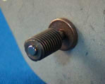 Photo of a motor with a worm gear on its drive shaft